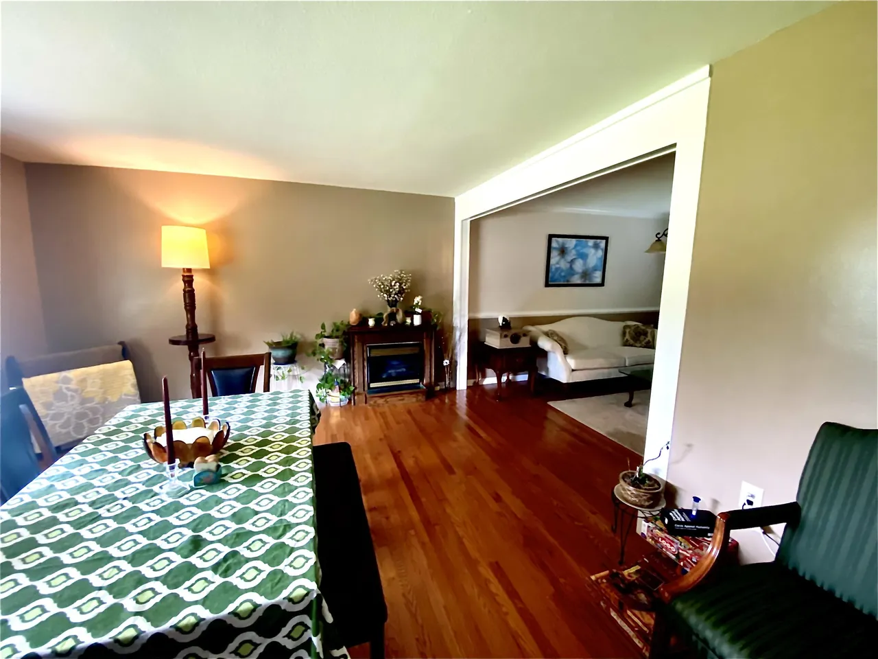 Dining and living room with hardwood flooring