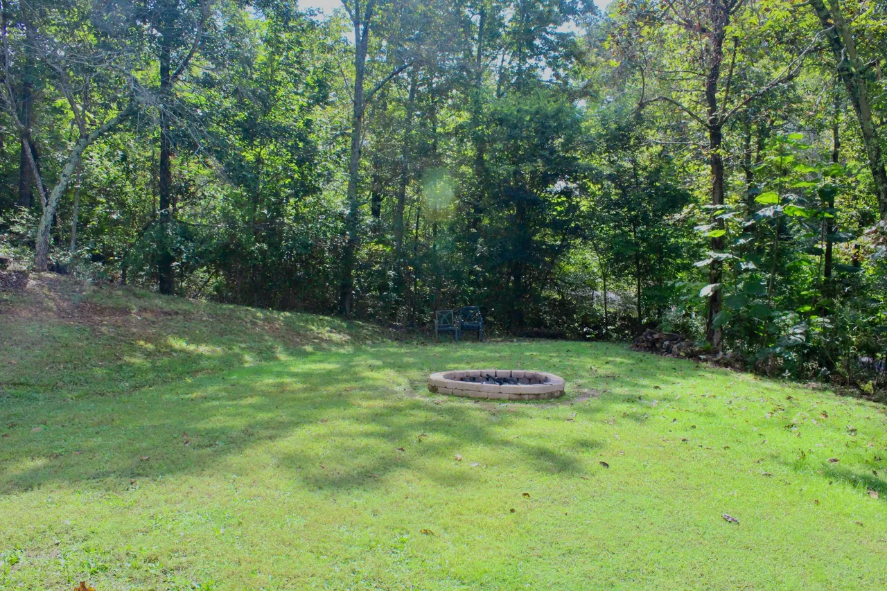 Wooded backyard fire pit area